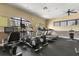 Well-equipped fitness room with treadmills, elliptical machines and plenty of space for exercise at 752 Sandy Bar Dr, Winter Garden, FL 34787