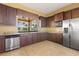 Modern kitchen featuring stainless steel appliances, granite countertops, and ample cabinet space for storage at 752 Sandy Bar Dr, Winter Garden, FL 34787