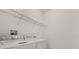 Laundry room with washer, dryer, and overhead wire shelving at 752 Sandy Bar Dr, Winter Garden, FL 34787