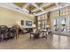 Clubhouse lounge showcasing comfortable seating, TV, high ceilings, and poolside access at 752 Sandy Bar Dr, Winter Garden, FL 34787