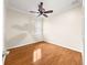 Bedroom featuring hardwood floors, a ceiling fan, and a window with blinds at 8045 Waterbury Way, Mount Dora, FL 32757