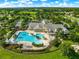 Aerial view of the community pool, clubhouse, and recreation areas, showcasing a resort-style experience at 8045 Waterbury Way, Mount Dora, FL 32757