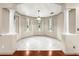 Bright dining room with tile floors, decorative columns, and large windows at 8045 Waterbury Way, Mount Dora, FL 32757