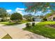 Single Gathering home in a quiet neighborhood boasts a well-maintained lawn and landscaping at 8045 Waterbury Way, Mount Dora, FL 32757