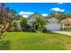Charming single-Gathering home boasts a well-manicured lawn and tropical landscaping at 8045 Waterbury Way, Mount Dora, FL 32757