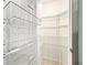 Organized walk-in pantry with shelving for ample storage of food and household items at 8045 Waterbury Way, Mount Dora, FL 32757