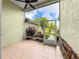 Relaxing screened porch offers outdoor space and beautiful views at 8045 Waterbury Way, Mount Dora, FL 32757