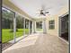 Sunroom features tile flooring, light walls and plenty of natural light and outdoor views at 8045 Waterbury Way, Mount Dora, FL 32757
