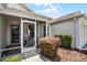 The inviting screened-in porch enhances the property's curb appeal at 8960 Se 178Th Muirfield Pl, The Villages, FL 32162