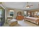 Serene main bedroom with a seating area, natural light, and ample closet space at 8960 Se 178Th Muirfield Pl, The Villages, FL 32162