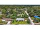Aerial view of home highlighting its well-manicured lawn in a serene neighborhood setting at 902 Lakeview Dr, Eustis, FL 32726