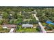 Aerial view of home highlighting its well-manicured lawn in a serene neighborhood setting at 902 Lakeview Dr, Eustis, FL 32726