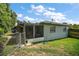 Backyard view with fenced-in patio and green grass at 902 Lakeview Dr, Eustis, FL 32726