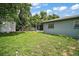 The backyard features a shed and a screened in porch, enclosed by a chain link fence at 902 Lakeview Dr, Eustis, FL 32726