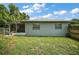 Exterior view of the home showcasing the roof, siding, and green grass at 902 Lakeview Dr, Eustis, FL 32726