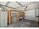 Interior view of garage with cabinets and wooden shelves at 902 Lakeview Dr, Eustis, FL 32726