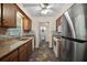 Updated kitchen features granite countertops, tile backsplash, stainless steel appliances, and dark wood cabinets at 902 Lakeview Dr, Eustis, FL 32726