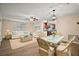 Cozy living room features plush seating, stylish decor, and an adjacent dining area for entertaining at 902 Lakeview Dr, Eustis, FL 32726
