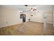Spacious living room with wood flooring adjacent to kitchen with stainless steel appliances at 902 Lakeview Dr, Eustis, FL 32726
