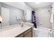 The bathroom offers vanity lighting, ceramic tiling, and updated fixtures for a modern, fresh, and clean look at 910 Rangeline Rd, Longwood, FL 32750