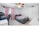 This bedroom features comfortable carpets, a ceiling fan, and a built-in closet for a relaxing and organized living space at 910 Rangeline Rd, Longwood, FL 32750
