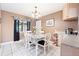 Bright dining room features a table for four and a chandelier at 910 Rangeline Rd, Longwood, FL 32750