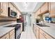 Well-equipped kitchen features stainless steel appliances and ample cabinet space at 910 Rangeline Rd, Longwood, FL 32750