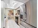 The modern kitchen features stainless steel appliances, ample cabinet space, and sleek countertops for a stylish culinary experience at 910 Rangeline Rd, Longwood, FL 32750