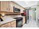 Contemporary kitchen boasts granite counters and stainless steel appliances at 910 Rangeline Rd, Longwood, FL 32750