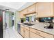 This kitchen has granite countertops, lots of storage space, and modern appliances for cooking delicious meals at home at 910 Rangeline Rd, Longwood, FL 32750