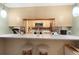 Open concept kitchen features granite countertops and modern appliances at 910 Rangeline Rd, Longwood, FL 32750