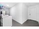 The laundry room has modern appliances, additional storage, and tile flooring for an easy and efficient laundry experience at 910 Rangeline Rd, Longwood, FL 32750