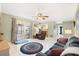 Relax in the inviting living room with sliding glass doors that let in lots of natural light for a warm, welcoming atmosphere at 910 Rangeline Rd, Longwood, FL 32750