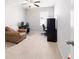 Versatile bedroom featuring an armchair and desks, easily convertible into a home office for work or relaxation at 9785 Pepper Tree Trl, Wildwood, FL 34785
