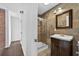 Modern bathroom features a glass shower, updated sink, and elegant tile flooring at 4219 Magnolia Ave, Leesburg, FL 34748