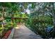 Covered dock provides serene waterfront views and easy access to the water for boating and recreation at 4219 Magnolia Ave, Leesburg, FL 34748