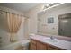 Well-lit bathroom featuring a shower/tub combination and a single sink vanity at 1007 Diego Ct, The Villages, FL 32159