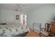 Spacious bedroom featuring wood floors, a bed, and a window providing natural light at 1007 Diego Ct, The Villages, FL 32159