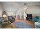 Spacious living room with vaulted ceilings, a ceiling fan, and hardwood floors, perfect for relaxation and entertainment at 1007 Diego Ct, The Villages, FL 32159