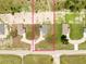 Aerial view of a home showcasing the entire lot with a defined boundary line and neighborhood setting at 10128 County Road 229, Oxford, FL 34484