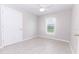 Cozy bedroom with tile flooring, a ceiling fan, and a window providing natural light, creating a comfortable space at 10128 County Road 229, Oxford, FL 34484