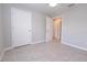 Well-lit bedroom featuring tile flooring, a ceiling fan, and two large closets for ample storage at 10128 County Road 229, Oxford, FL 34484