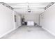 Large two-car garage includes washer and dryer and utility sink hookups for added convenience at 10128 County Road 229, Oxford, FL 34484