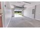 Spacious two-car garage with an automatic door and ample space for parking or storage at 10128 County Road 229, Oxford, FL 34484