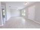 Bright and spacious living room featuring tile floors, a ceiling fan, and large windows for natural light at 10128 County Road 229, Oxford, FL 34484