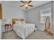 Bedroom featuring a ceiling fan, carpet, and a mirror at 109 Falling Acorn Ave, Groveland, FL 34736