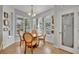 Cozy breakfast nook with lots of natural light from the windows and a view of the backyard at 109 Falling Acorn Ave, Groveland, FL 34736