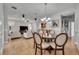 Open-concept living and dining area with tile flooring, chandelier, and comfortable seating at 109 Falling Acorn Ave, Groveland, FL 34736