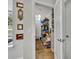Well-organized walk-in pantry featuring shelving, ample storage, and tiled flooring at 109 Falling Acorn Ave, Groveland, FL 34736