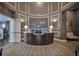 Stylish reception area with modern design, lighting, and convenient reception desk at 109 Falling Acorn Ave, Groveland, FL 34736
